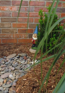 We found this little guy to guard our front flowerbed. Isn't he cute?